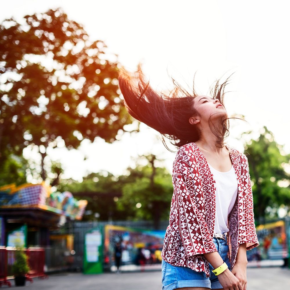 Young Girl Hair Fling Funfair Festive Playful Happiness Concept