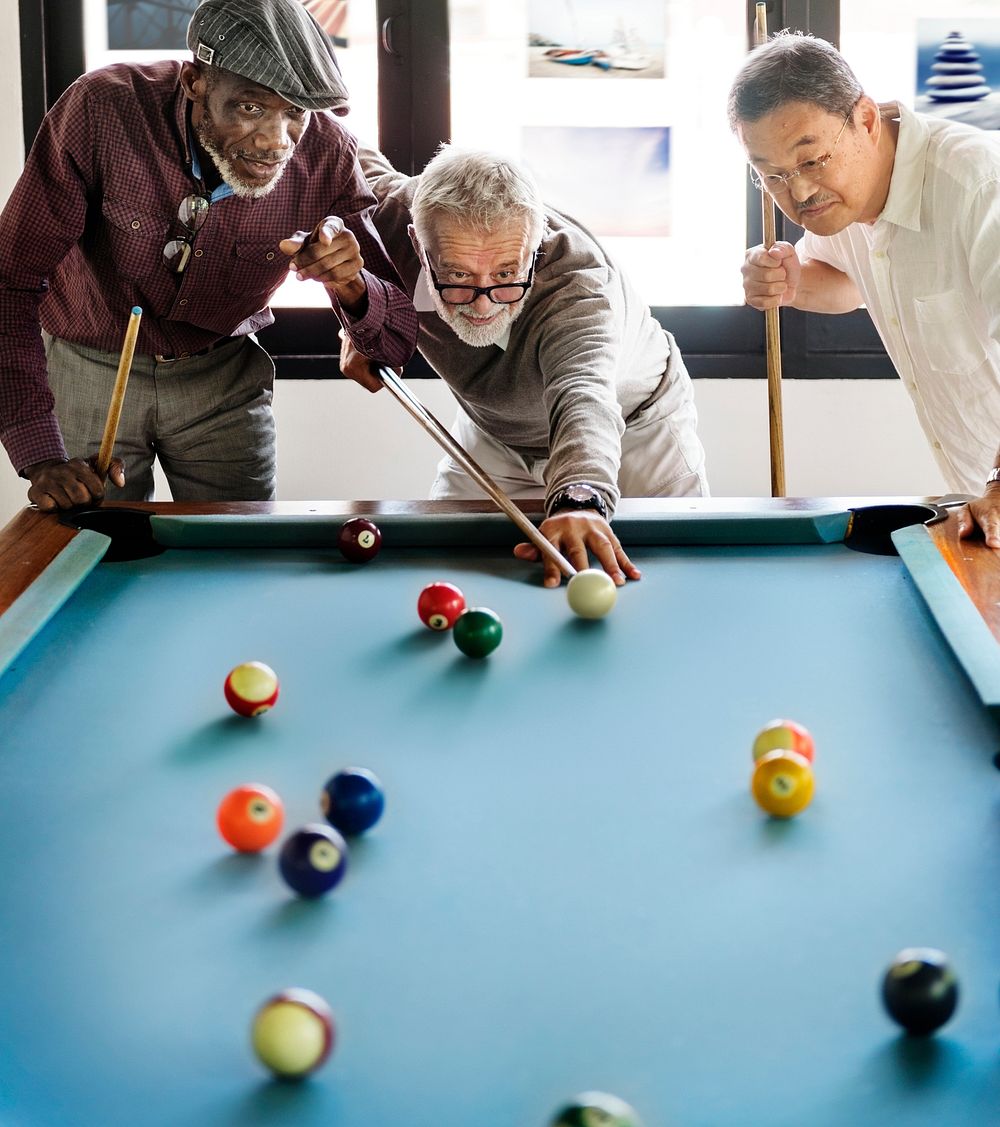 Senior friends playing pool