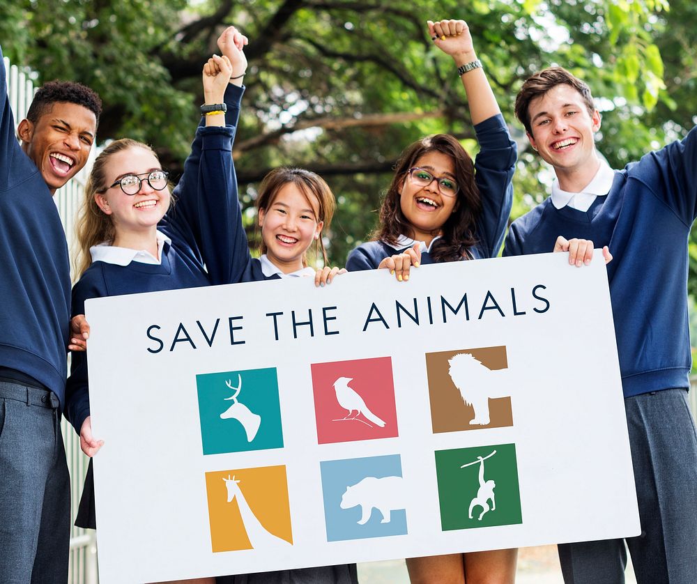 Students holding save animals banner