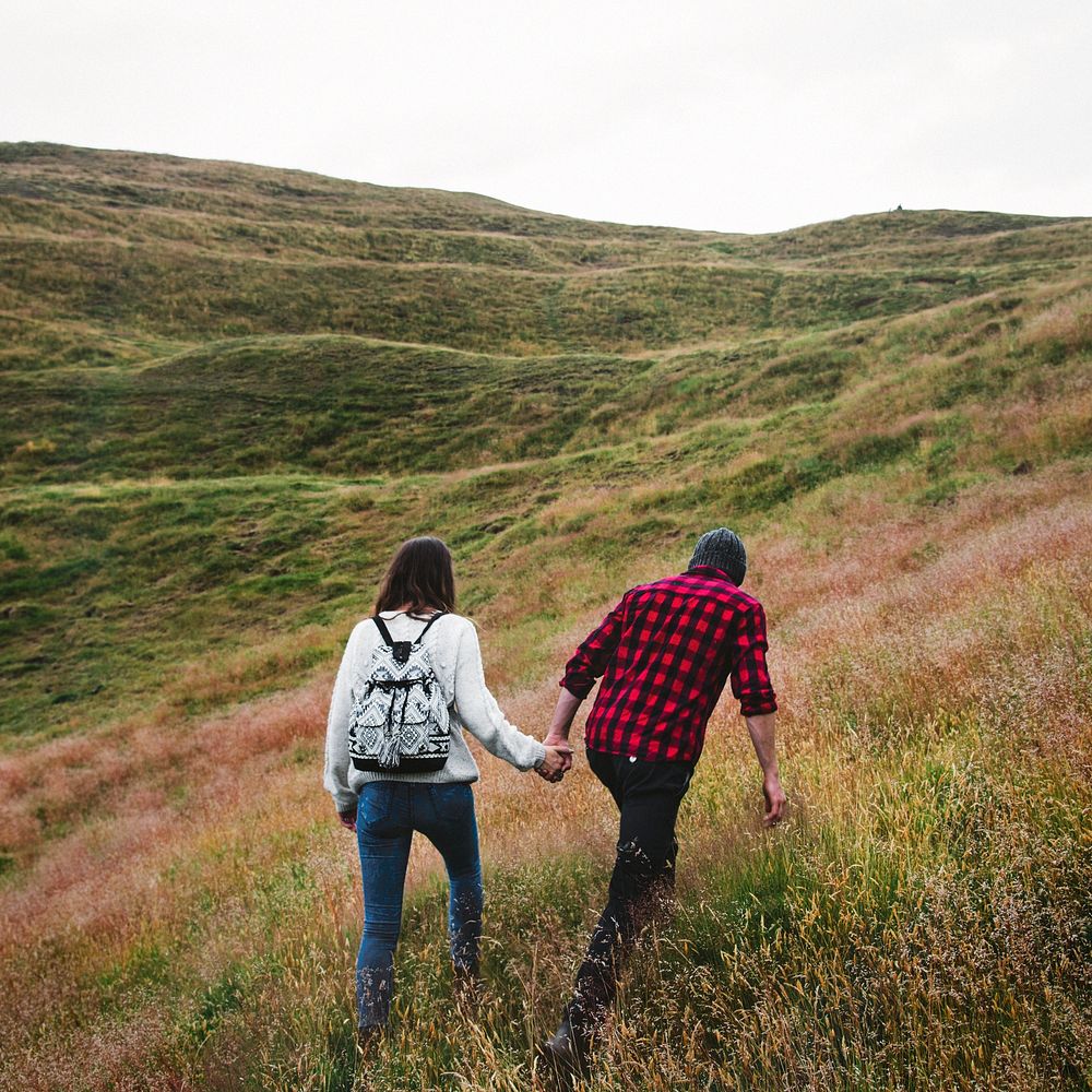 Couple trekking the hills together