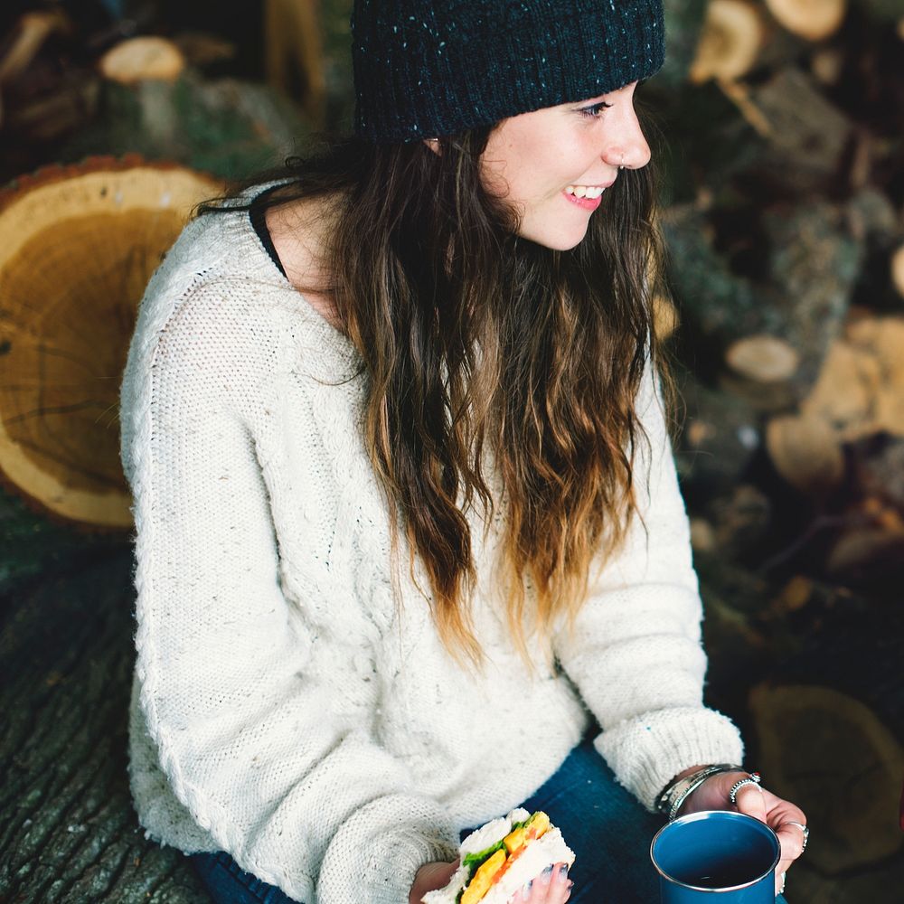 Woman eating sandwich