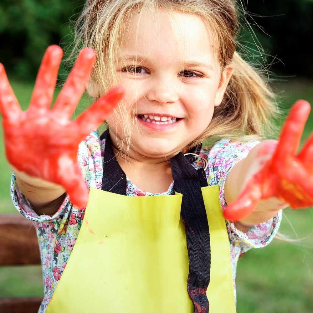 Kid showing painted hands