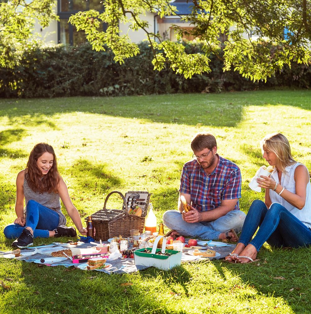 Happy family picnic in the park