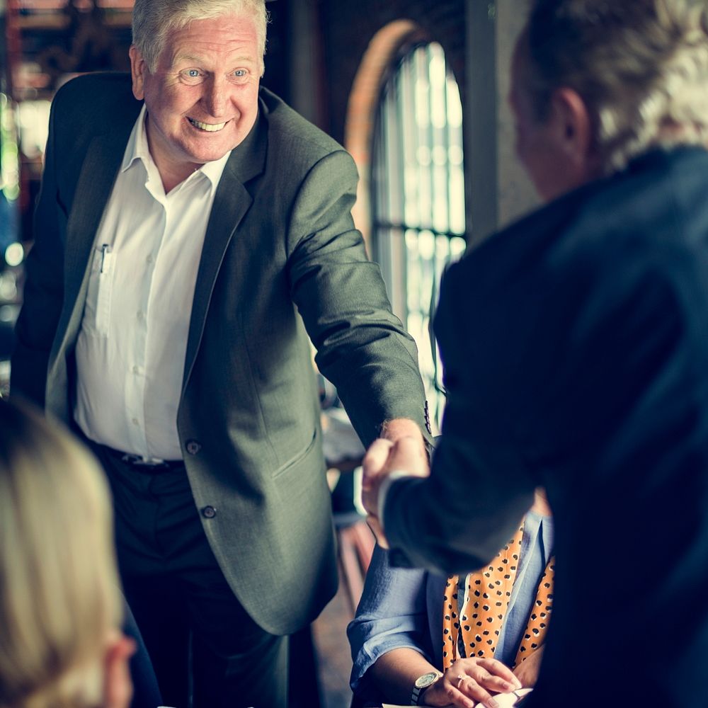 Business People Shaking Hands Agreement Concept