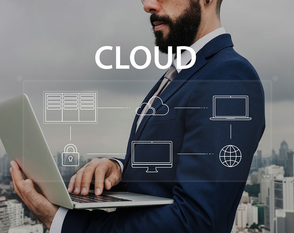 Man using laptop cloud network graphic overlay
