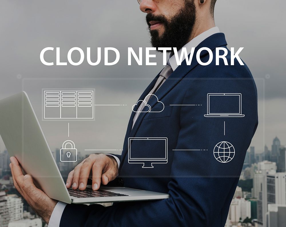 Man using computer cloud network graphic overlay