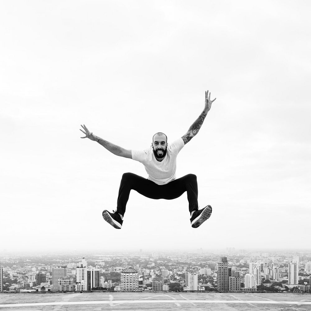 Man jumping on a rooftop