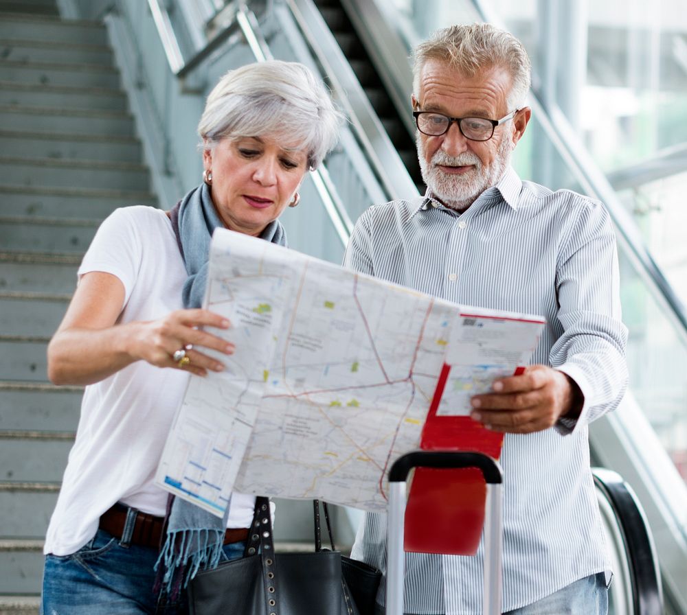 Senior couple tourists traveling city