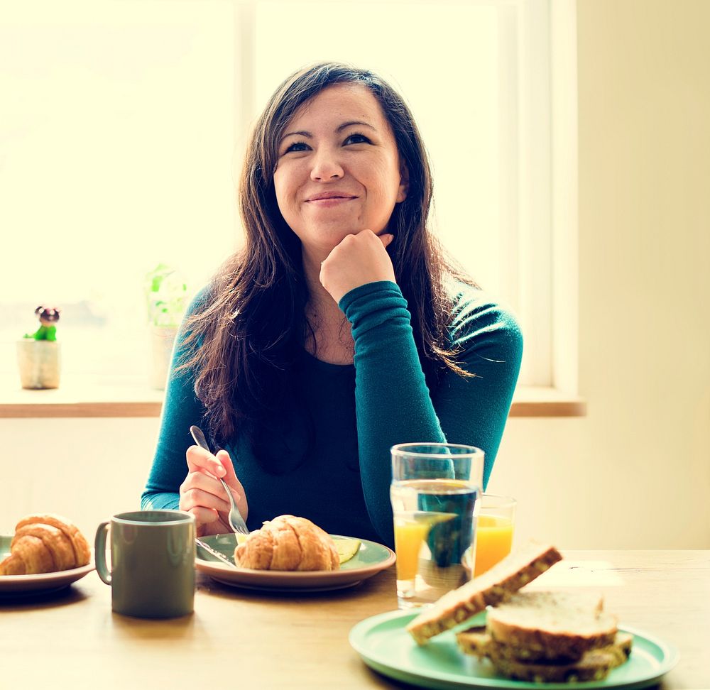 Caucasian Woman Eating Breakfast Pyjamas