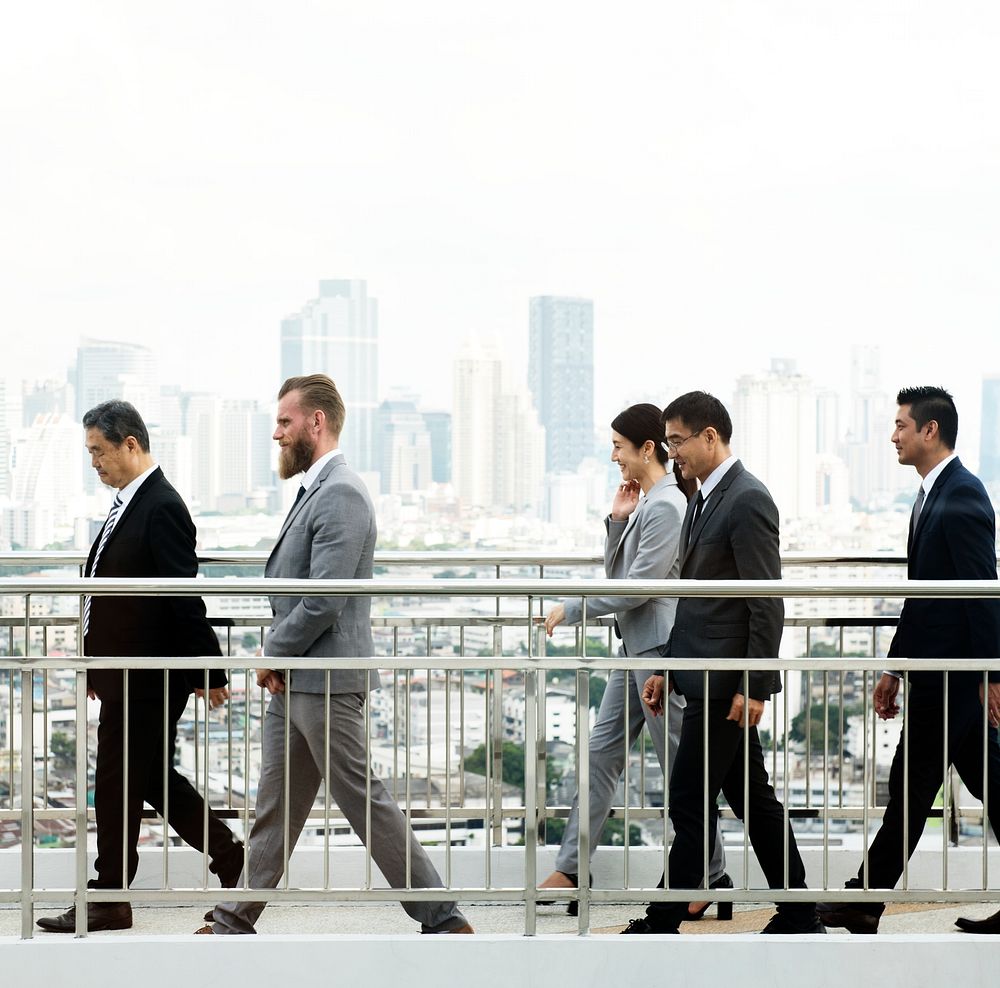 Diverse business people walking together