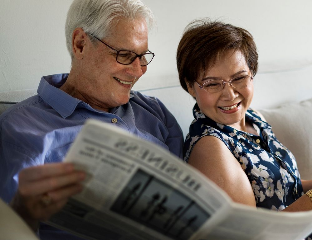 Senior Couple Read Newspaper Crochet