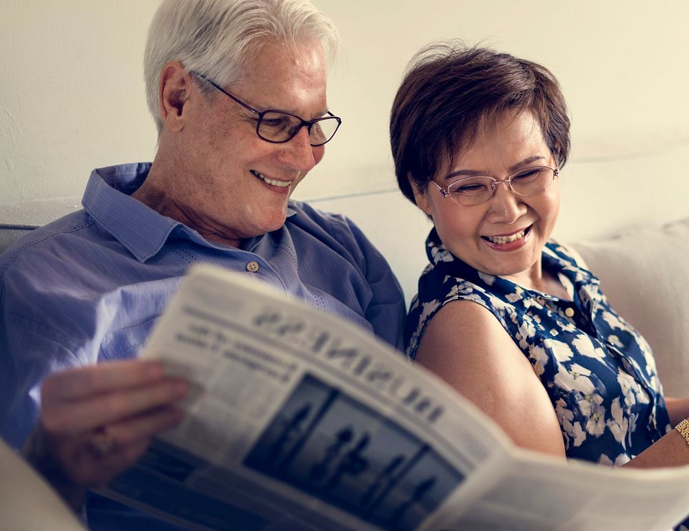 Senior Couple Read Newspaper Crochet