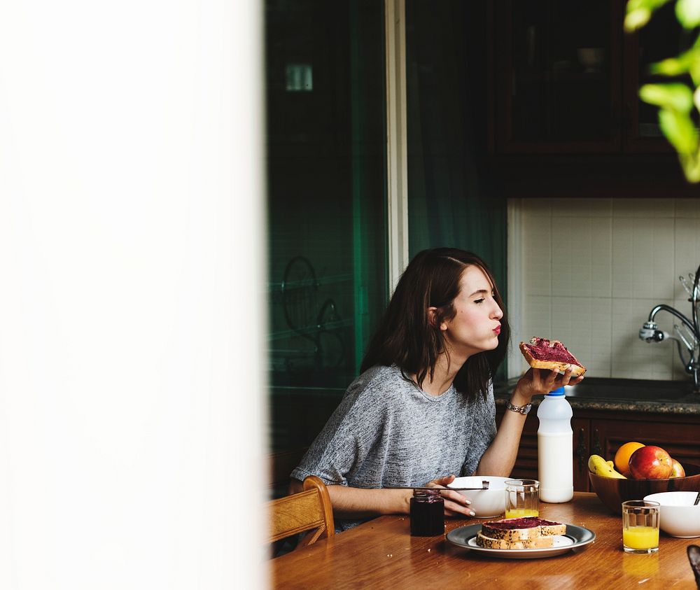 Woman having breakfast at home