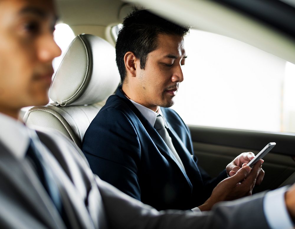 Businessman Use Tablet Inside Car