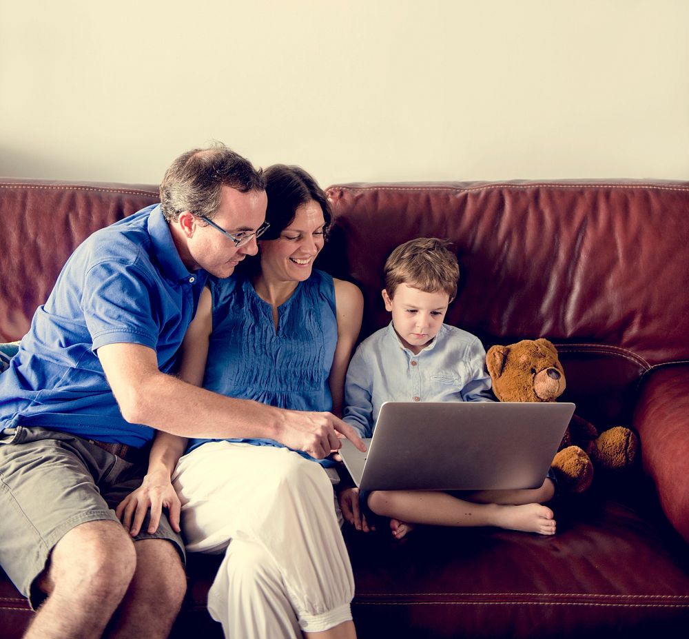 Caucasian Family Spend Time Holiday Together Using Laptop Relax