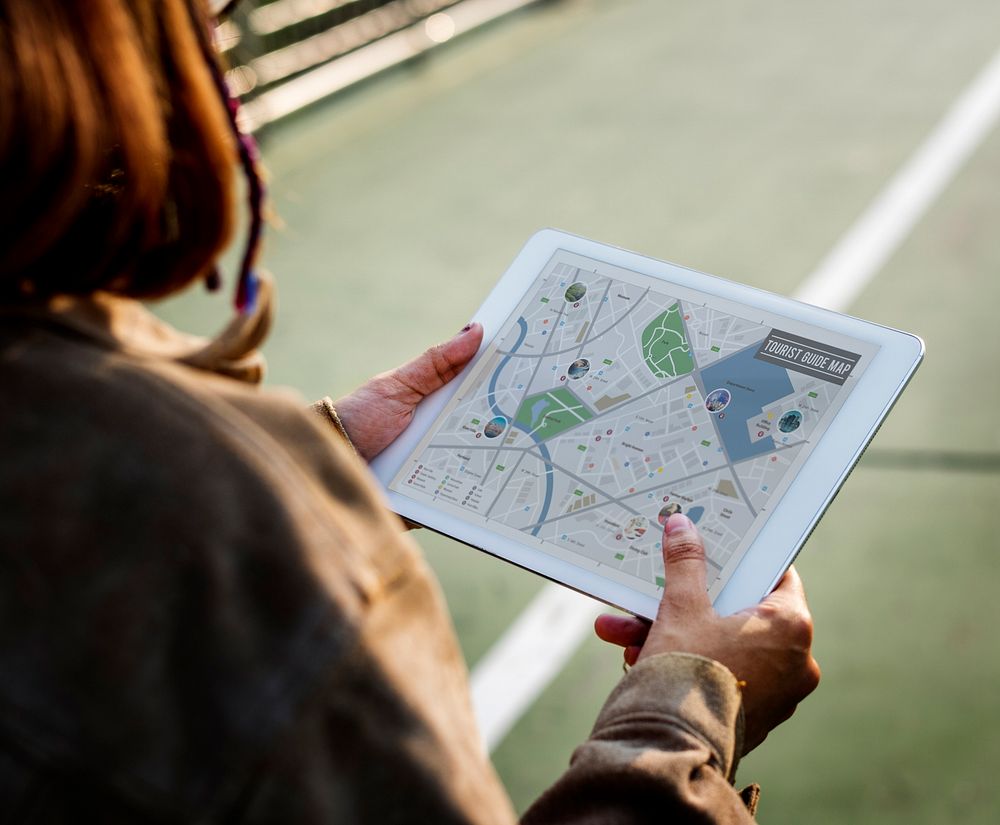 Woman looking at a map on tablet