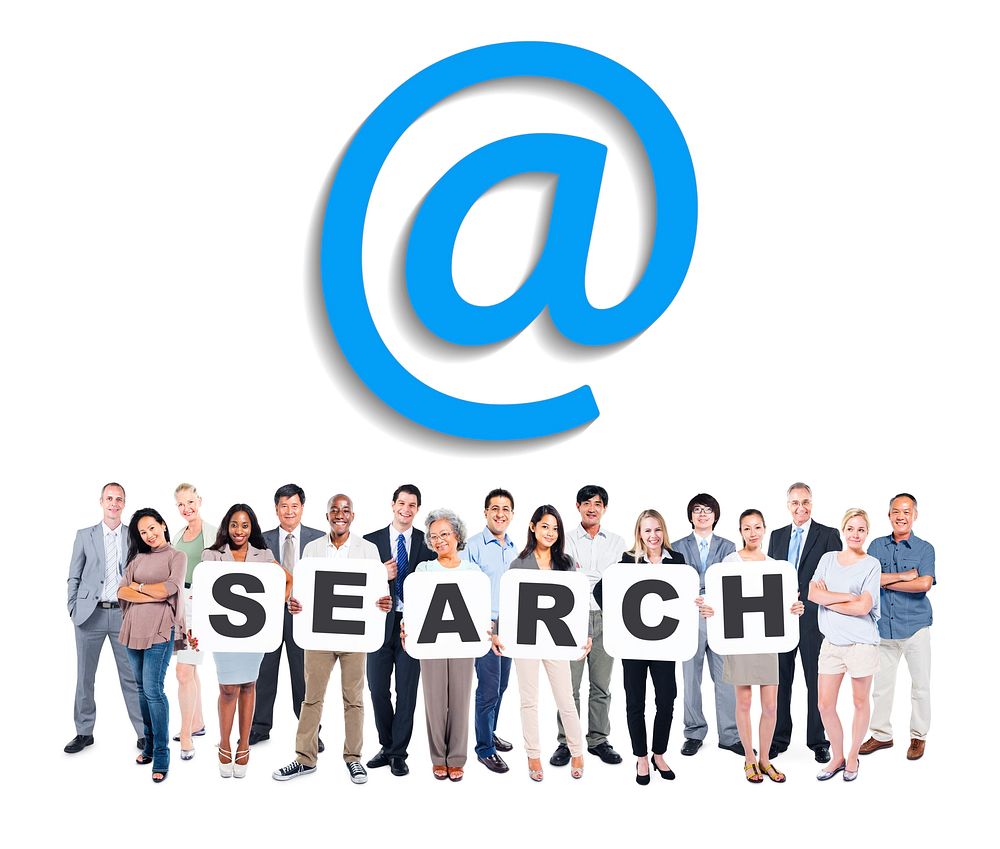 Multi-Ethnic Group Of Business And Casual People Holding Letters That Form Search And Related Symbol Above