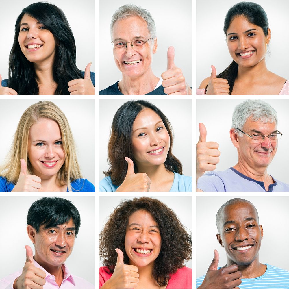 Multi-Ethnic Group Of People Pointing Their Thumbs Up