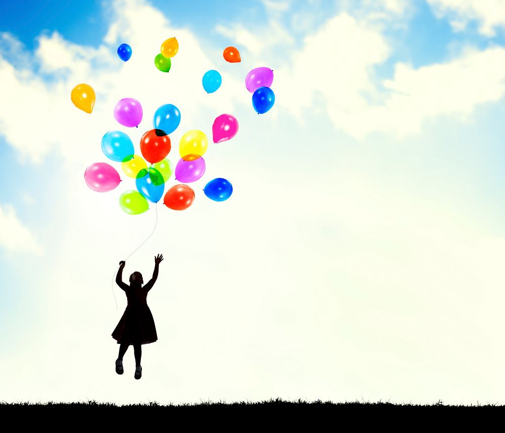 Little Girl in the Air Holding Balloons