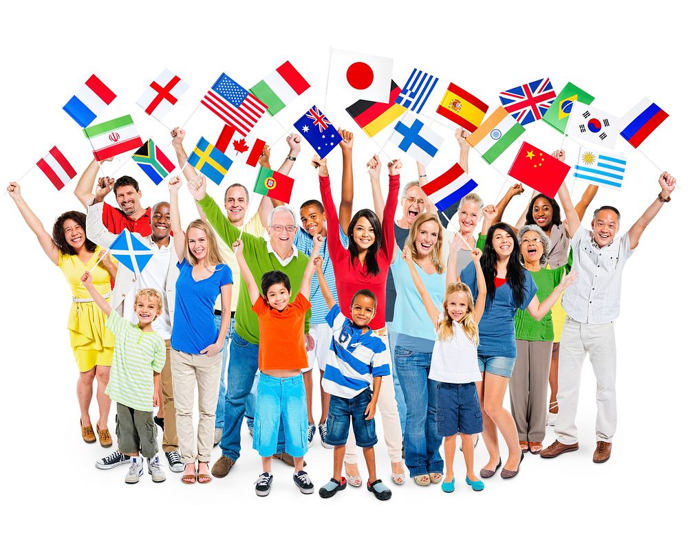 Large group of multi-ethnic diverse mixed age people celebrating while holding flags.