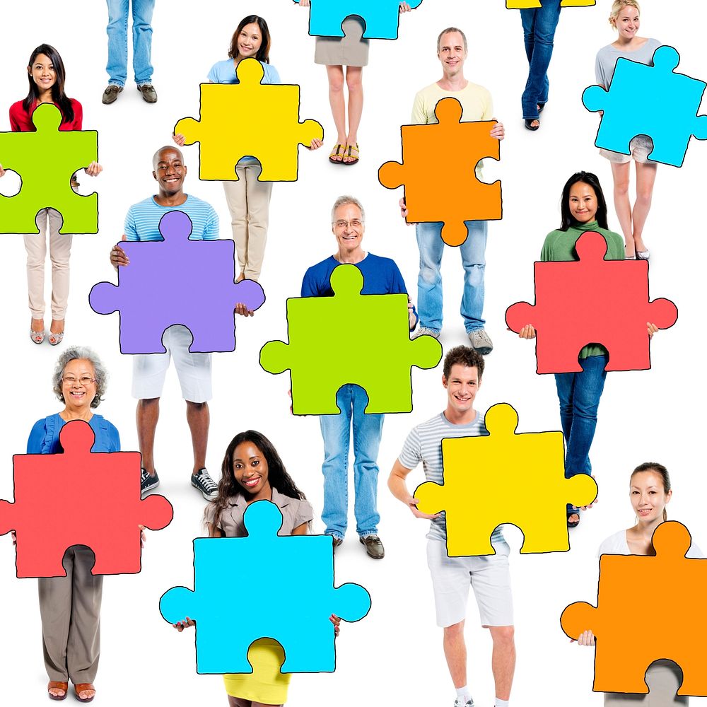 Group of People Holding Jigsaw Puzzle Piece