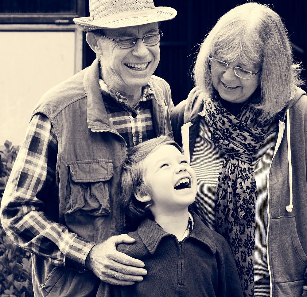 Grandparents and Grandson Smiling Cheerfully Together