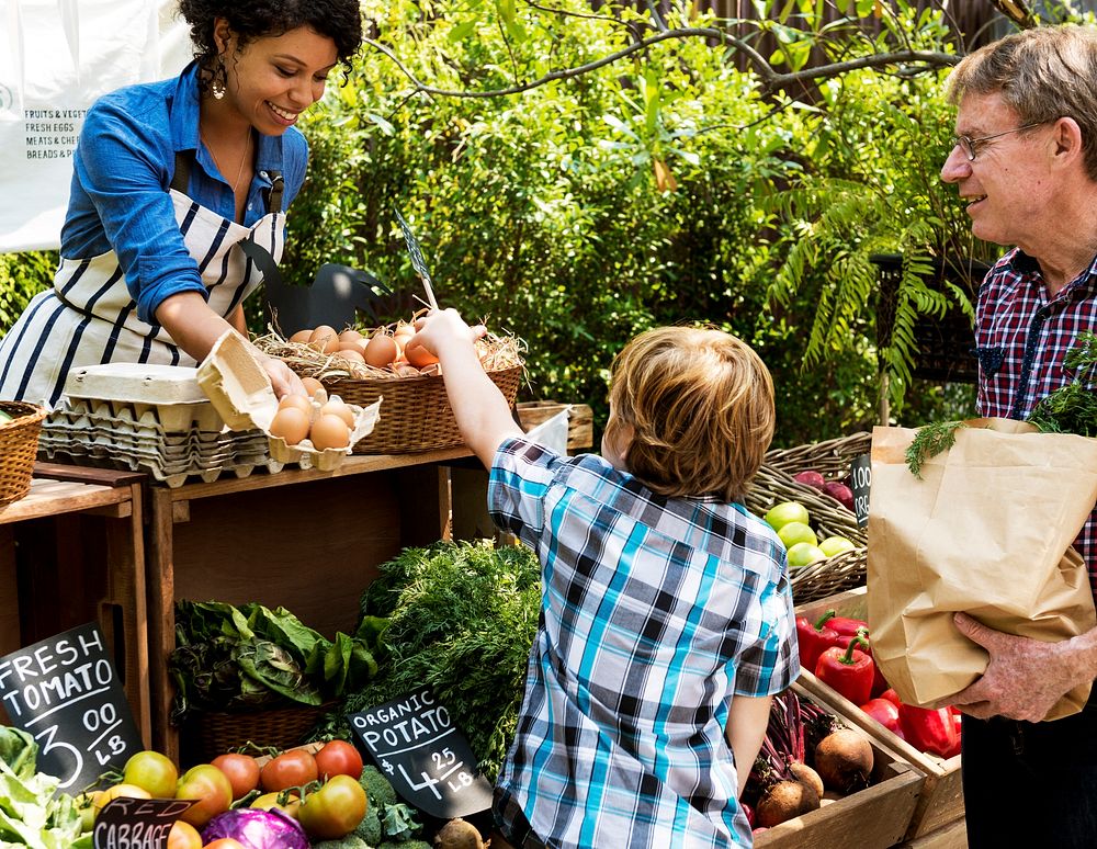 Woman owner fresh grocery organic shop with customer