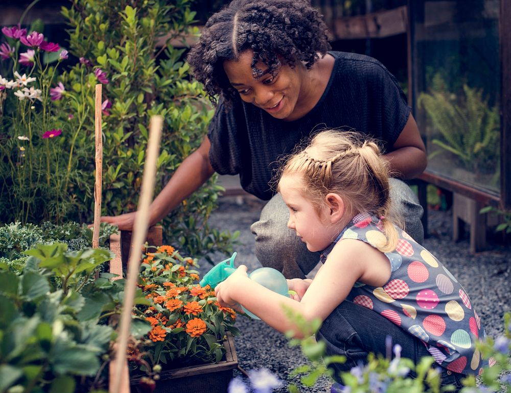 Teacher and little girl school learning ecology gardening