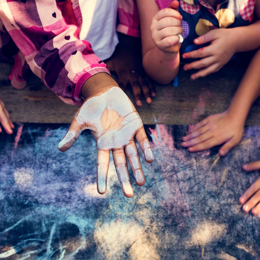 Group of dirty children hand from chalk drawing