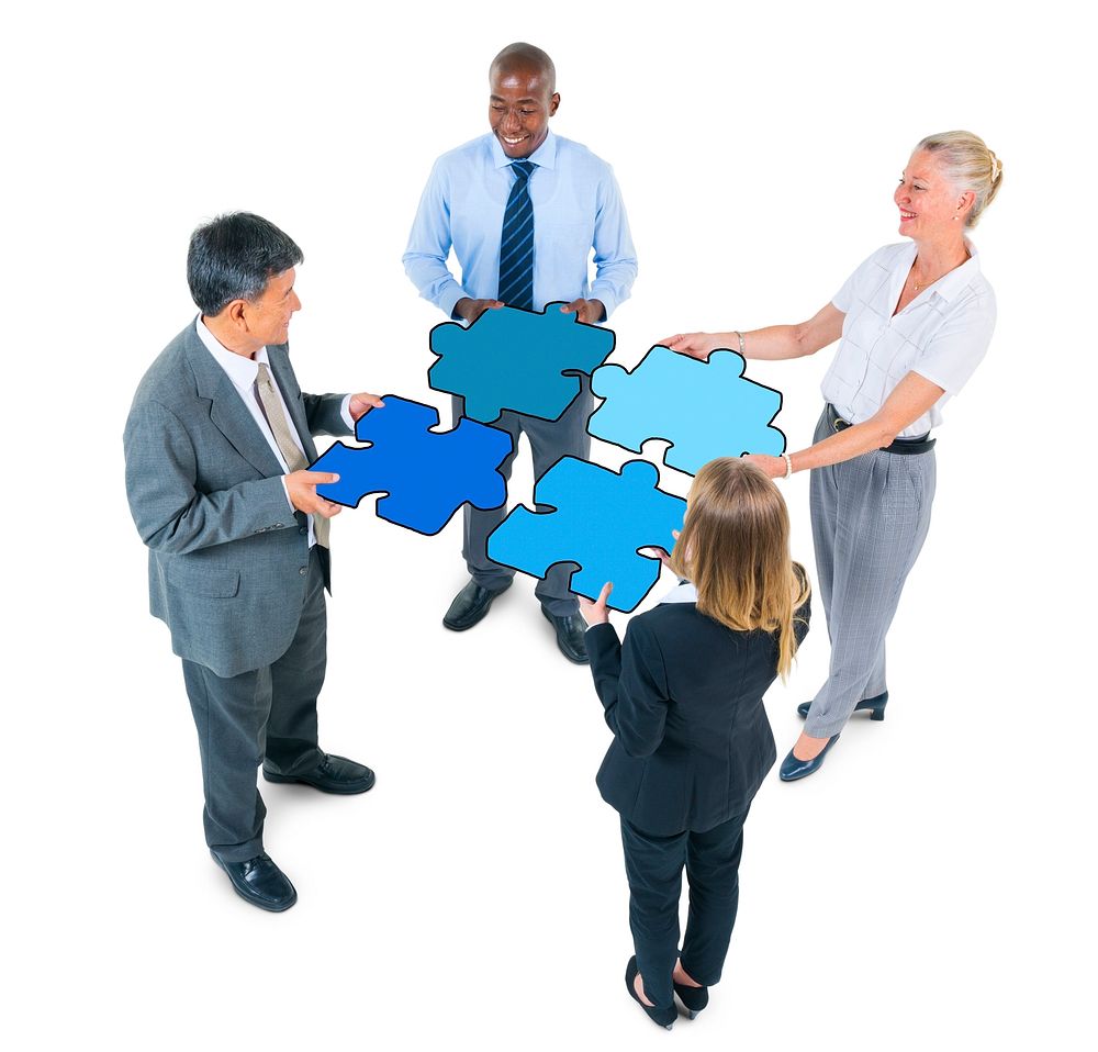 Group of Business People Connecting Jigsaw Puzzles
