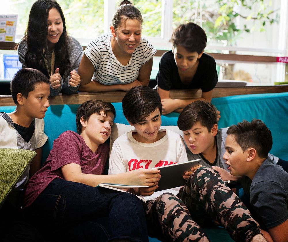 Group of young adult watching using tablet device