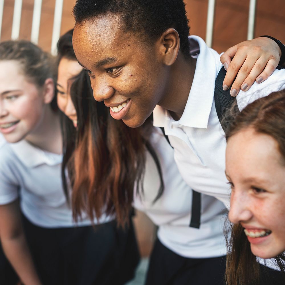 Group of students huddle together