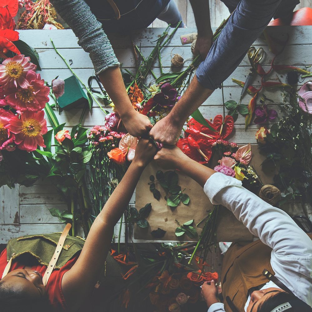 Group of people decorate the flower