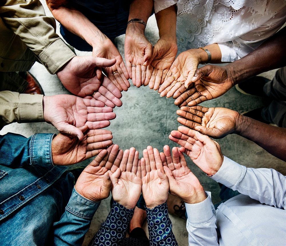 Group of diverse hands in a circle 