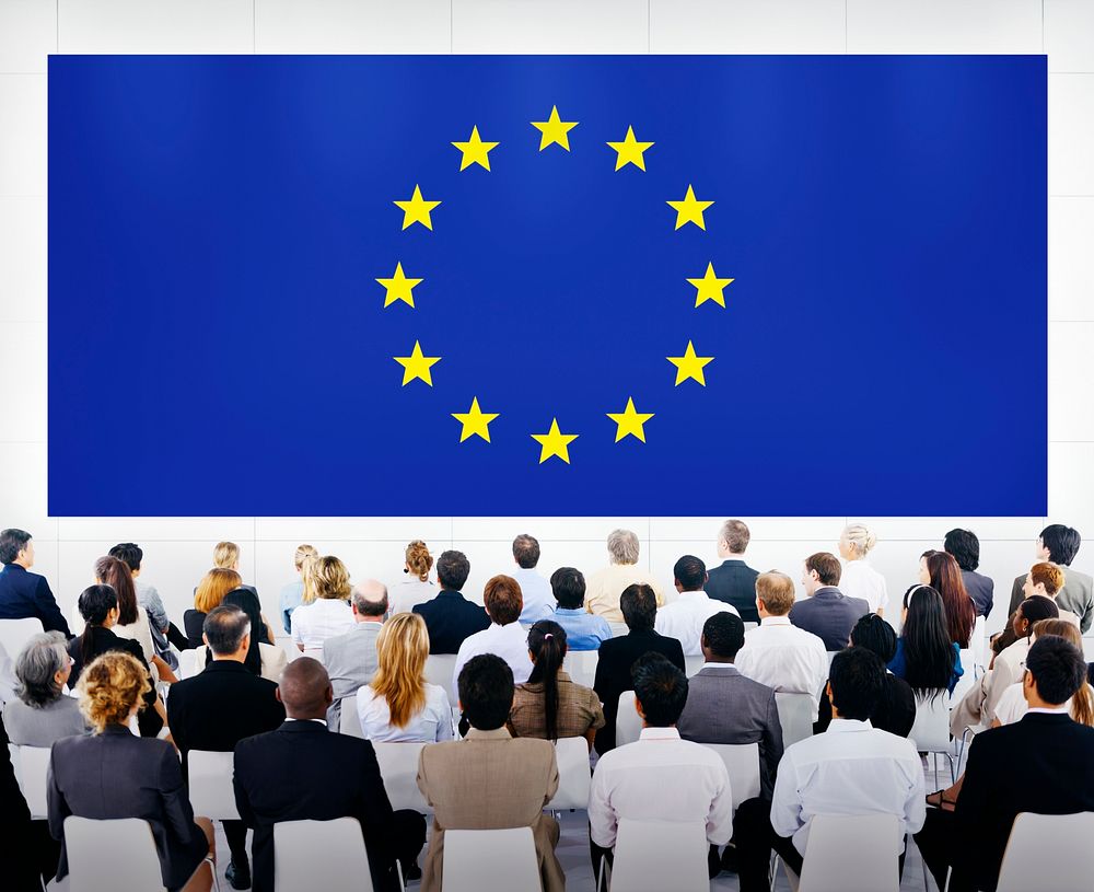 Group Of Business People Looking At The Europe Union Flag