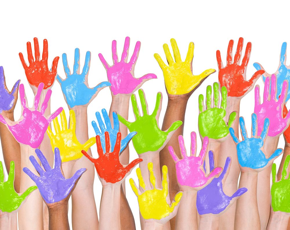 Multi ethnic people's colorful pinted hands raised
