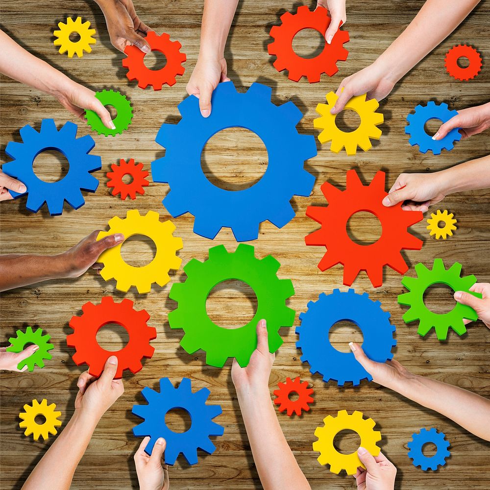 Group of Hands Holding Gears Symbol