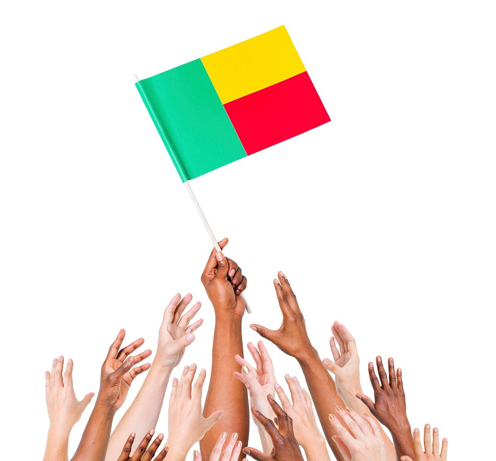 Group Of People Reaching For And Holding The Flag Of Benin