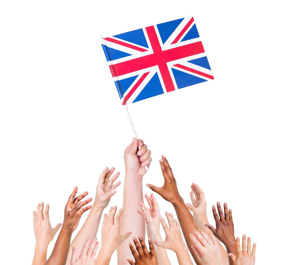 human hand holding Great Britain flag among multi-ethnic group of people's hands