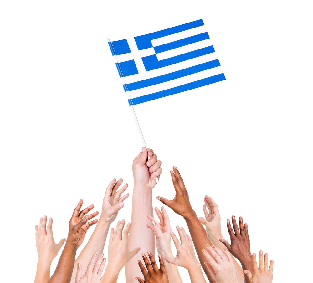 Group of multi-ethnic people reaching for and holding the flag of Greece.
