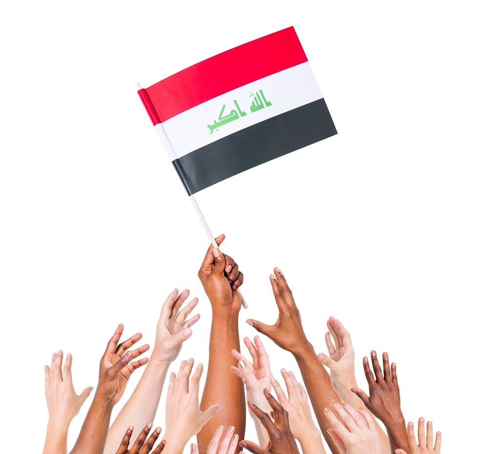 Human hand holding Iraq Flag among group of multi-ethnic hands