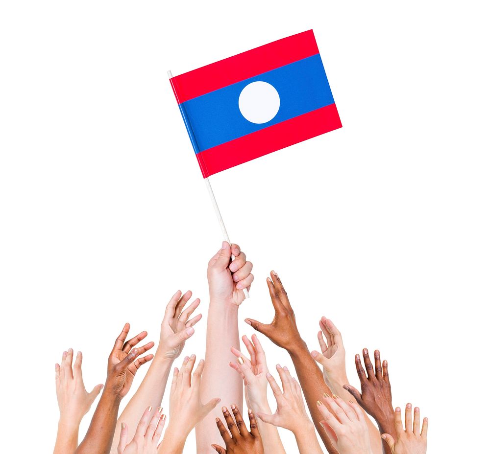 Group of multi-ethnic people reaching for and holding the flag of Laos.