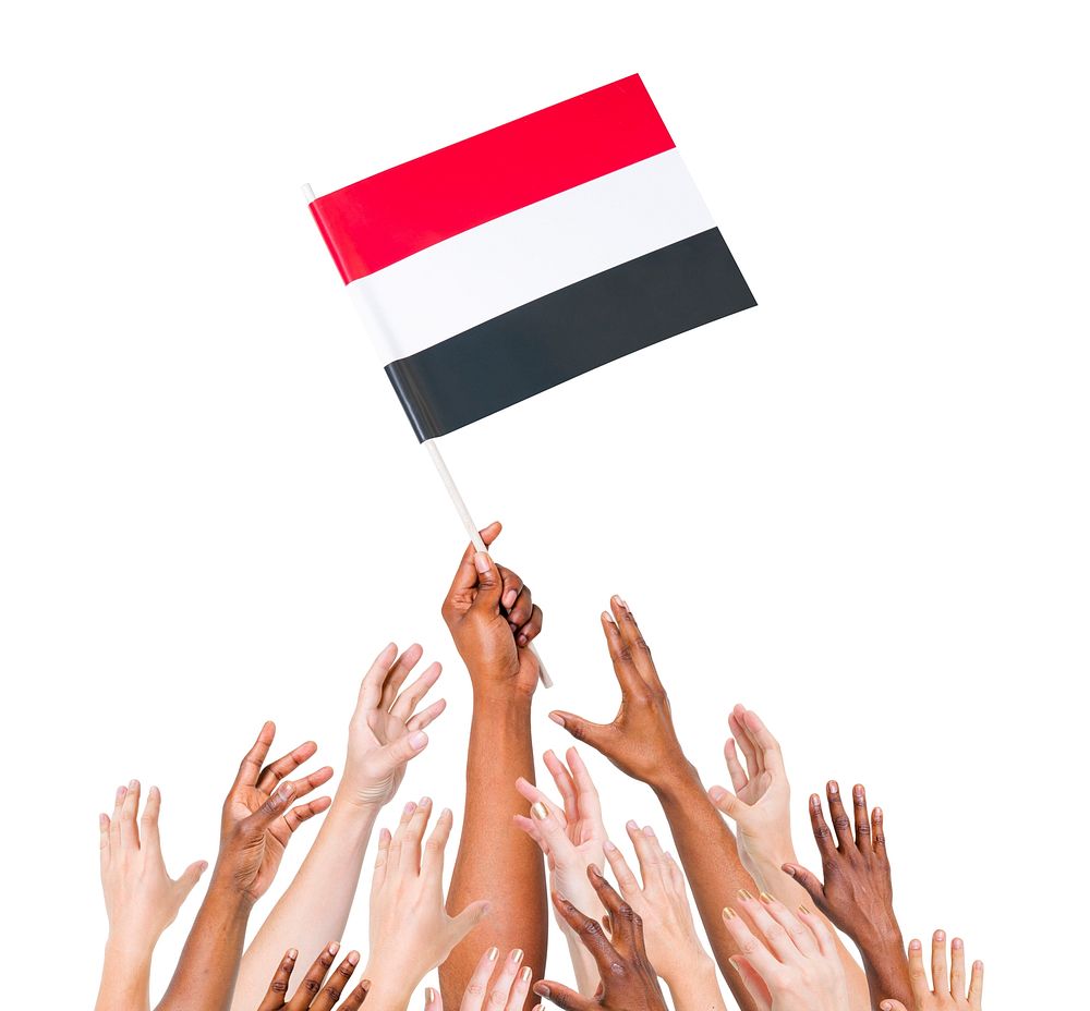 Human hand holding Yemen flag among multi-ethnic group of people's hand