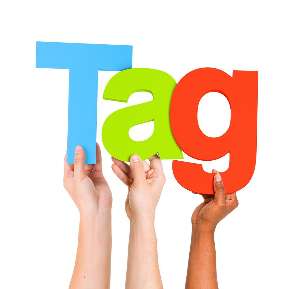Multi-Ethnic Group of Diverse People Holding Letters To Form A Word Tag For Tag Cloud