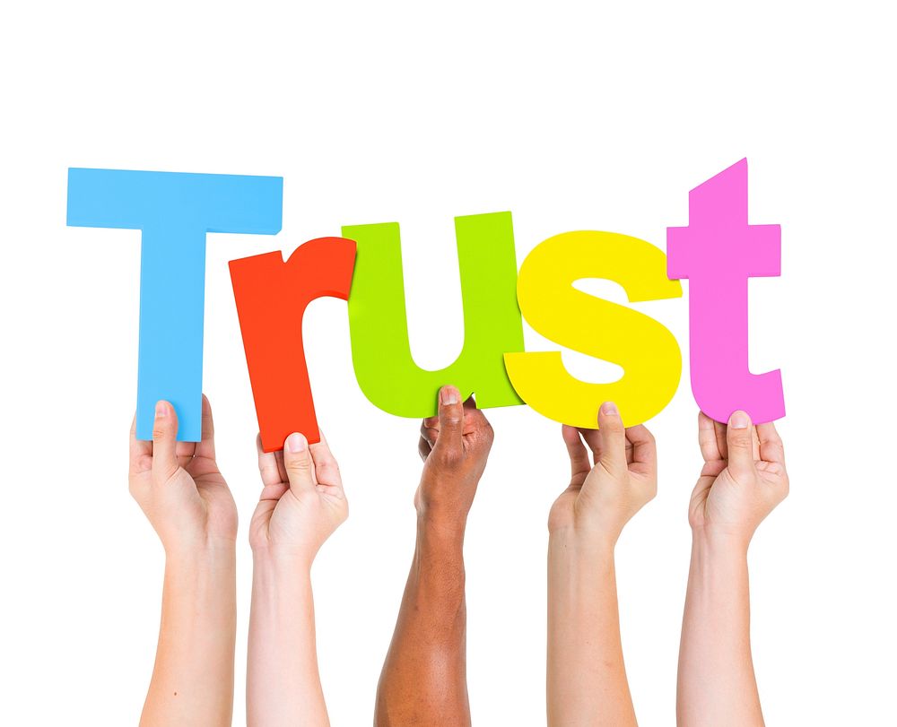 Diverse People Holding Single Word Trust
