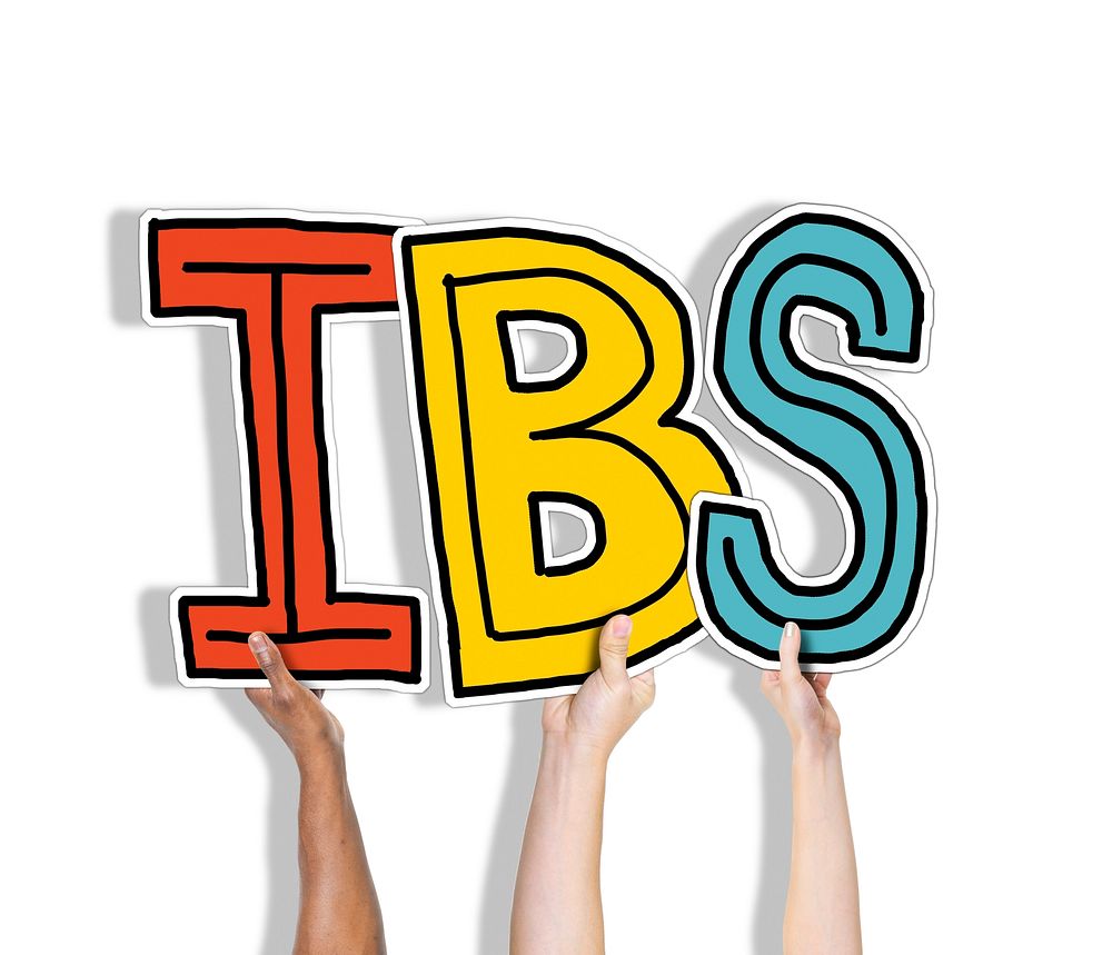 Group of Hands Holding IBS Letter