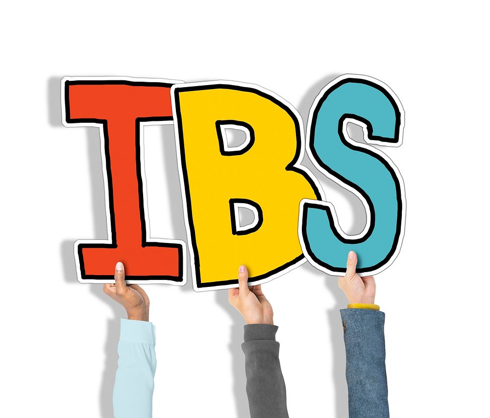 Group of Hands Holding IBS Letter
