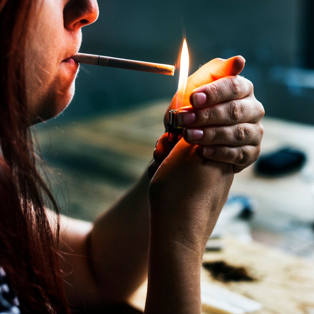 Woman lighting a cigarette