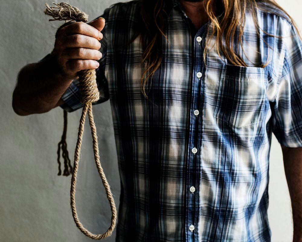 Guy holding a broken suicide rope