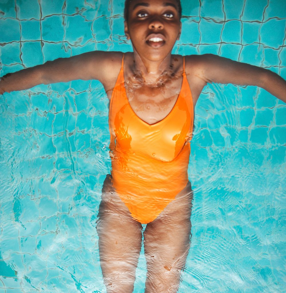Closeup of african descent woman floating in the pool
